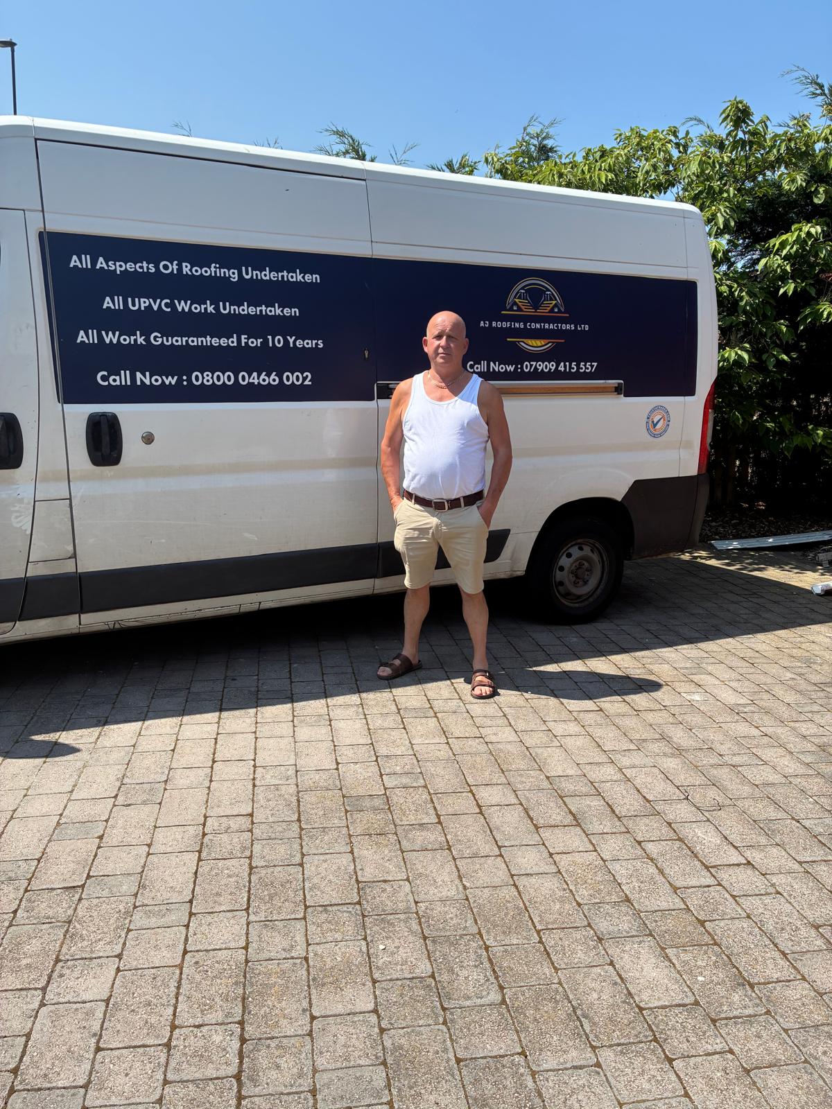 AJ beside the AJ Roofing Contractors van